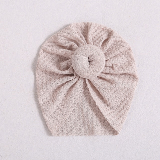 Beige pale pink donut hat/turban hat for reborn baby girls or newborn babies. Fit newborns up to age 3.