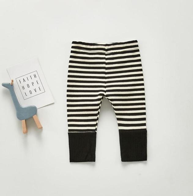 Black and white unisex gender neutral striped Scandinavian style baby leggings pants for reborns, baby girls, baby boys, silicone dolls and cuddle babies.