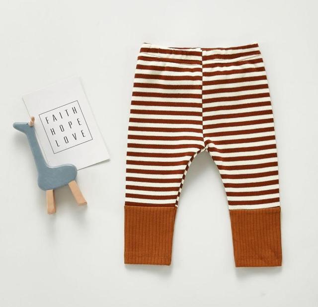 Terra cotta and white striped unisex gender neutral striped Scandinavian style baby leggings pants for reborns, baby girls, baby boys, silicone dolls and cuddle babies.